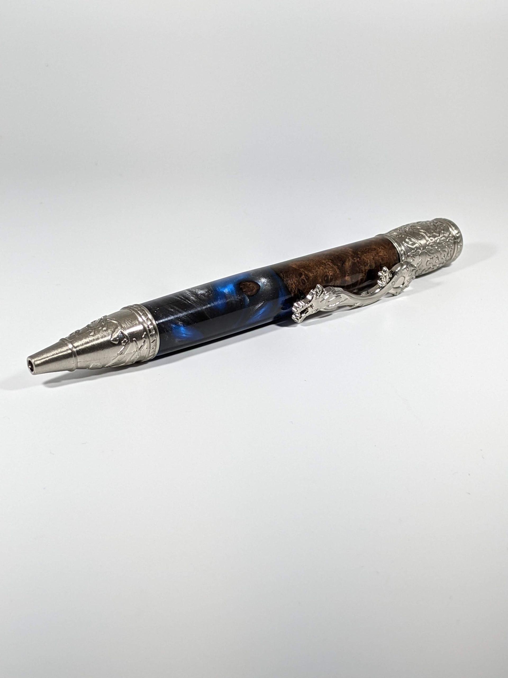 Ballpoint Dragon pen with Russian olive hybrid with blue, black, and silver epoxy