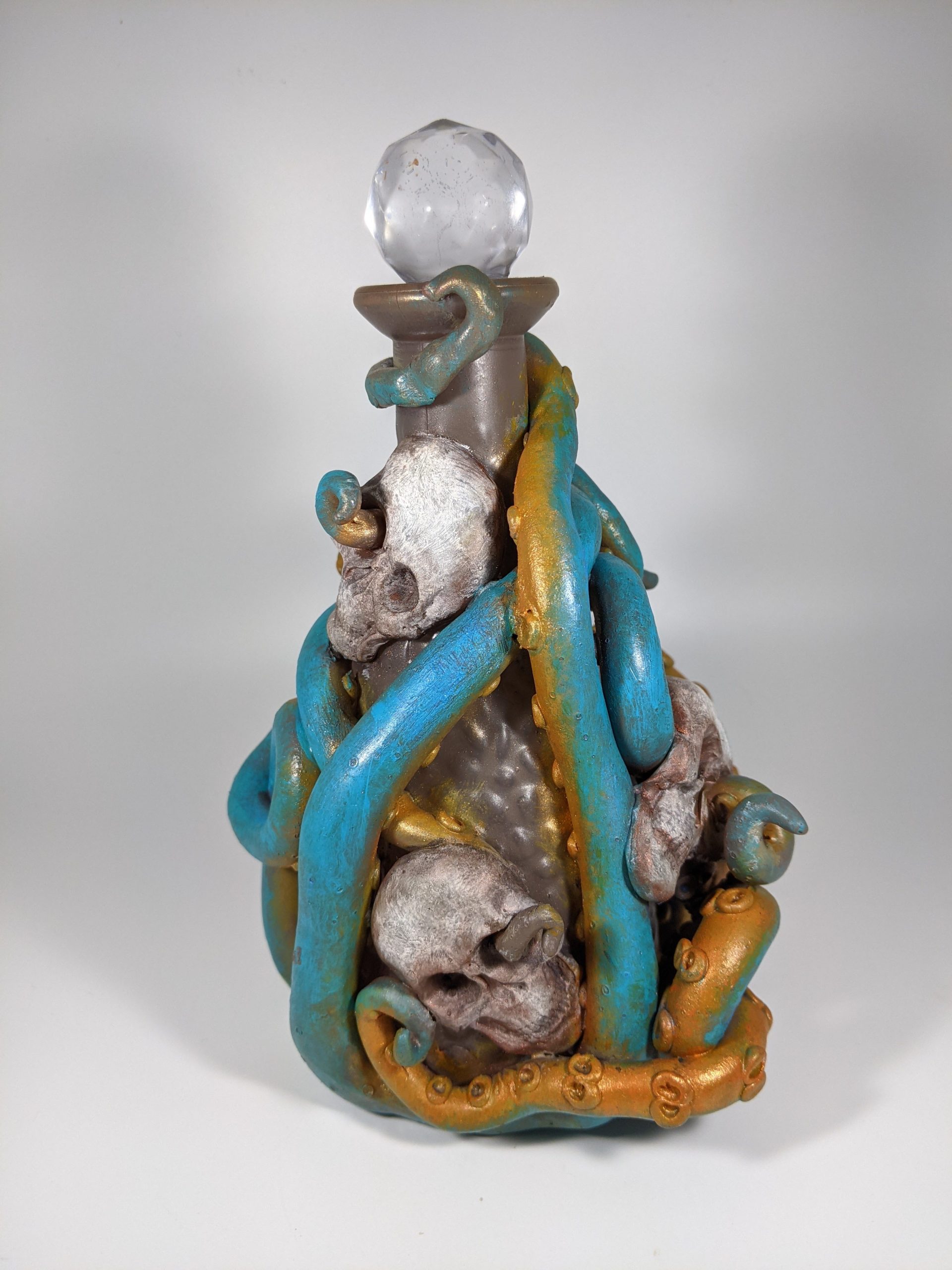 Davey Jones' locker. Tapered bottle wrapped with turquoise octopus.